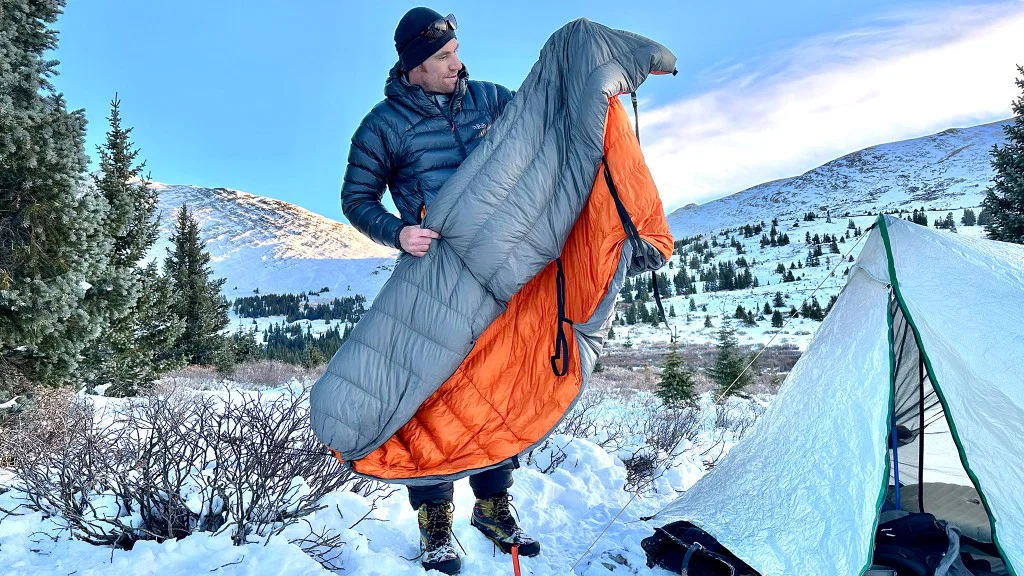 Sleeping bag set up at a campsite for camping, hiking, and outdoor adventures in nature